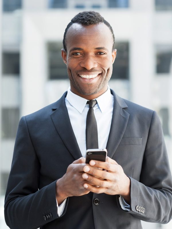 businessman-with-mobile-phone--e1621805508140.jpg